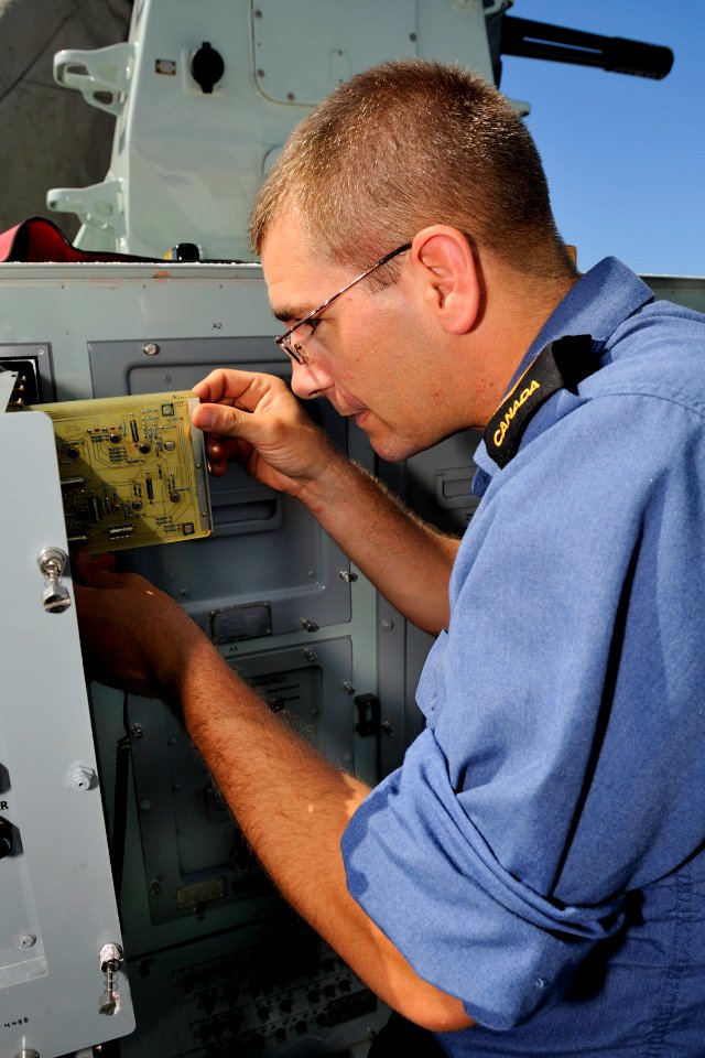 US Navy 100708-O-0000S-081 Master Seaman Shawn Zweers troubleshoots the Close-In Weapons System aboard HMCS Algonquin (DD 283)
