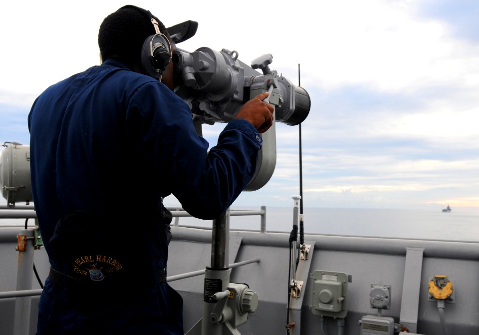 US Navy 100706-N-7948R-064 Seaman Jiron Cummings stands the forward lookout watch aboard the amphibious dock landing ship USS Pearl Harbor (LSD 52)