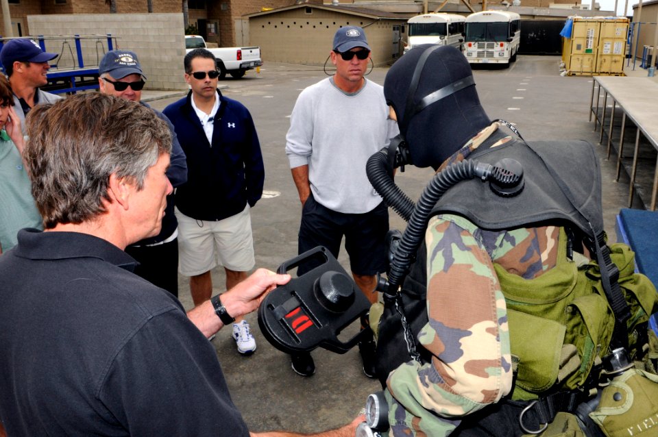 US Navy 100706-N-7883G-025 Former National Football League (NFL) quarterback Troy Aikman and current NFL quarterback A.J. Feeley are given a tour of the Naval Special Warfare Center