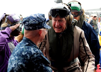 US Navy 100714-N-3885H-031 Former President George H.W. Bush is greeted by Capt. Chip Miller photo