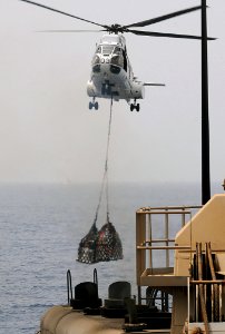 US Navy 100710-N-1082Z-072 An SA-330J Puma helicopter assigned to the USNS Robert E. Peary (T-AKE 5) carries supplies to the USS Ashland (LSD 48)