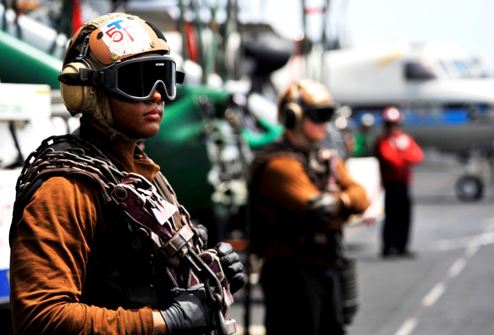 US Navy 100710-N-6003P-087 Plane captains assigned to the aircraft carrier USS Harry S. Truman (CVN 75) are standing by to chain an aircraft