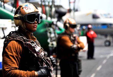 US Navy 100710-N-6003P-087 Plane captains assigned to the aircraft carrier USS Harry S. Truman (CVN 75) are standing by to chain an aircraft