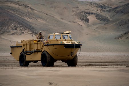 US Navy 100707-N-5319A-122 Boatswain's Mate 2nd Class Julio Morales, assigned to Beach Master Unit (BMU) 1, stands safety watch as a lighter amphibious re-supply cargo (LARC) vehicle stands by on Salinas Beach, Peru