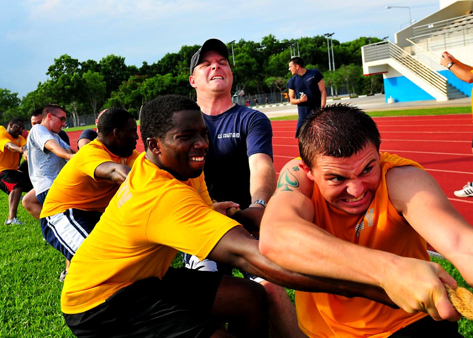 US Navy 100709-N-7643B-296 Sailors and Coast Guardsmen participate in a game of tug-of-war as part of the Cooperation Afloat Readiness and Training Singapore 2010 sports day