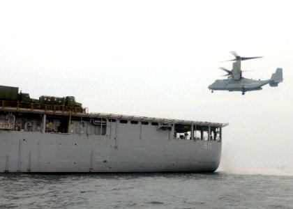 US Navy 100712-N-8069G-468 A Marine Corps V-22 Osprey prepares to land aboard the amphibious dock landing ship USS Carter Hall (LSD 50)