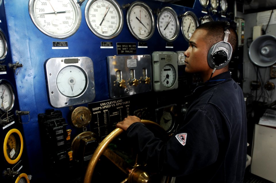 US Navy 100708-N-6477M-023 Machinist's Mate Fireman Christopher Tinoco maintains the ship's speed aboard USS Cleveland (LPD 7)