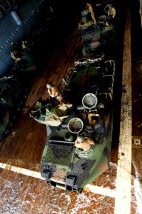 US Navy 100712-N-7532T-028 Soldiers assigned to Bravo Company, 2nd Battalion, Royal Australian Regiment, embark U.S. Marine Corps amphibious assault vehicles aboard the amphibious transport dock ship USS Cleveland (LPD 7)