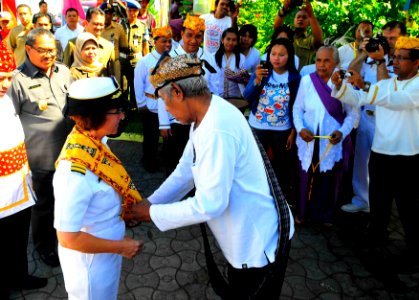 US Navy 100713-N-6410J-142 Capt. Lisa M. Franchetti, commander of Pacific Partnership 2010, receives a cultural garment from an Indonesian official