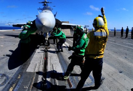 US Navy 100712-N-2953W-167 Sailor directs aircraft aboard USS Carl Vinson