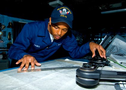 US Navy 100713-N-6720T-032 Sailor plots course for USS George Washington