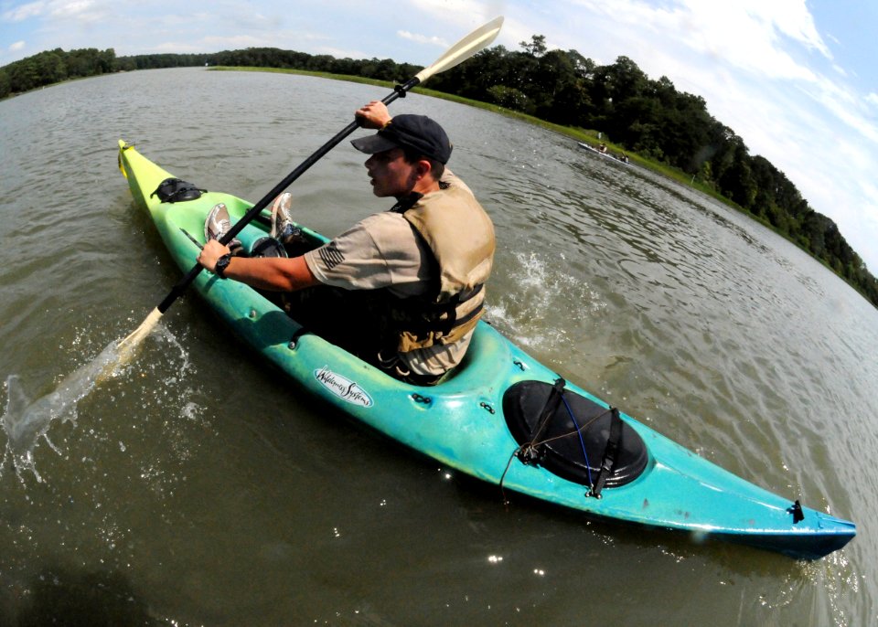 US Navy 100714-N-4267W-093 Michael Albritton navigates a kayak during a confidence building evolution at Camp Trident summer camp