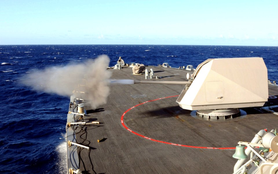 US Navy 100712-N-7058E-305 USS Freedom (LCS 1) fires its Mk-110 57mm gun during a surface gunnery exercise as part of the at-sea phase of Rim of the Pacific (RIMPAC) 2010 exercises