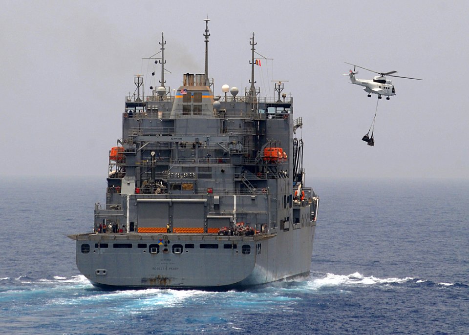 US Navy 100710-N-1082Z-034 An SA-330J Puma helicopter assigned to the USNS Robert E. Peary (T-AKE 5) carries supplies to the USS Ashland (LSD 48)