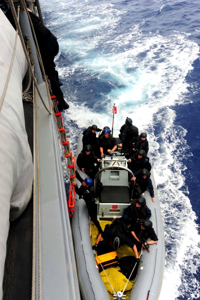 US Navy 100709-N-7200S-032 A Royal Canadian Navy visit, board, search and seizure team boards USS McClusky (FFG 41) from a rigid-hull inflatable boat