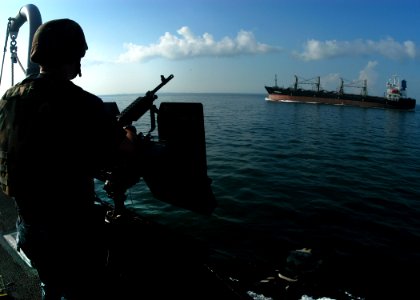 US Navy 100710-N-0995C-040 A Sailor stands a small craft attack team (SCAT) watch aboard the guided-missile destroyer USS Chung-Hoon (DDG 93)