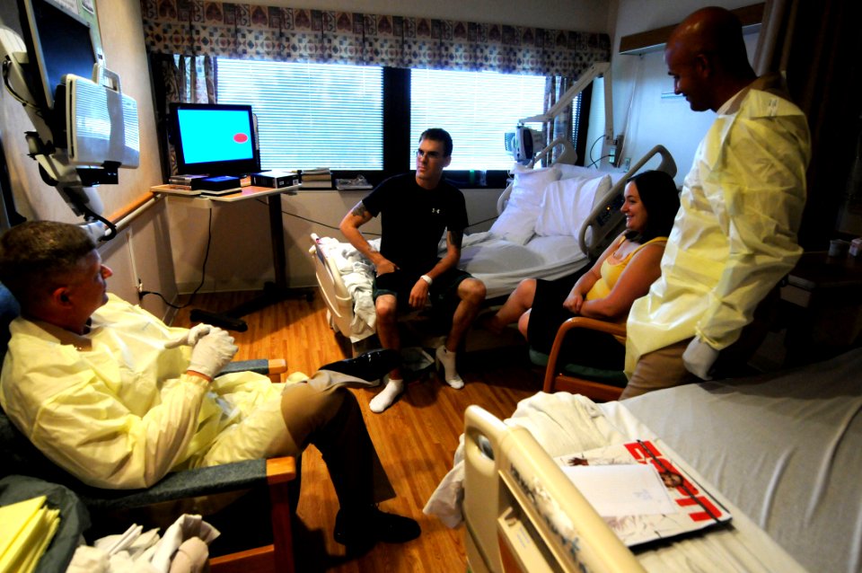 US Navy 100714-N-9818V-017 MCPON presents coins at the National Naval Medical Center