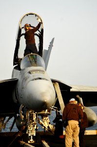 US Navy 100711-N-6362C-304 Sailors perform maintenance on a Super Hornet aboard USS Harry S. Truman