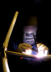 US Navy 100715-N-0569K-033 Aviation Structural Mechanic 2nd Class Timothy J. Workman fabricates a new piece for a spotting dolly that is used to position aircraft aboard the aircraft carrier USS Enterprise (CVN 65)