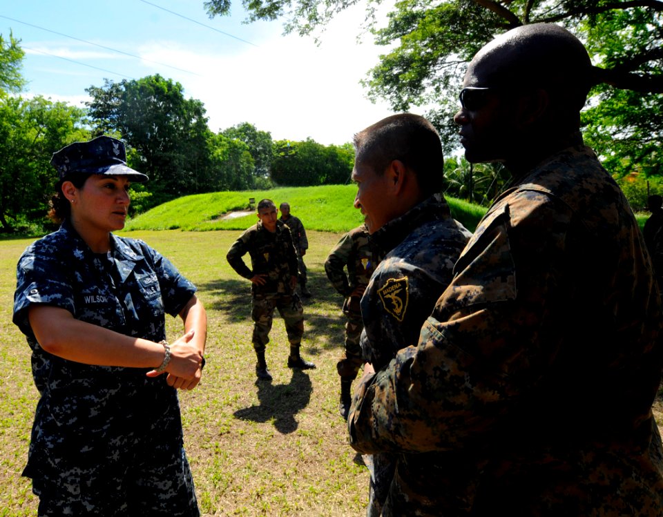 US Navy 100712-N-9643W-802 Yeoman 1st Class Ursula Wilson, assigned to High Speed Vessel Swift (HSV 2), translates for a Guatemalan marine during the Marine Corps martial arts subject matter exchange
