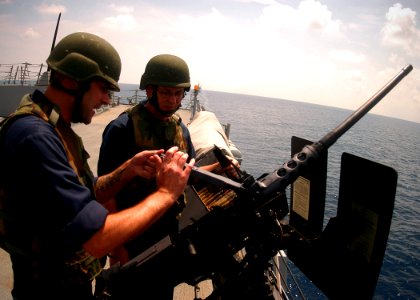 US Navy 100713-N-0995C-025 Sailors participate in a gunnery exercise for CARAT Singapore 2010