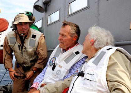 US Navy 100714-N-3885H-174 Former President George H.W. Bush watches flight operations aboard USS George H.W. Bush (CVN 77) photo