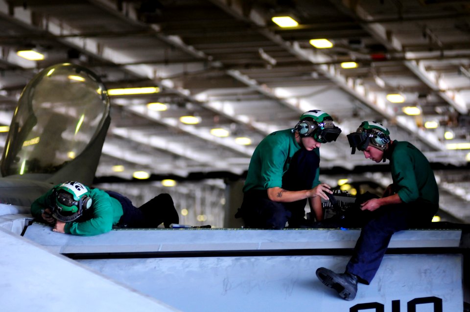 US Navy 100713-N-3659B-170 Aviation Structural Mechanics 3rd Class Mark Alzapiedi, left, from Boston, John Goodwin, from Chesapeake, Va., and John Beard, from Salt Lake City,