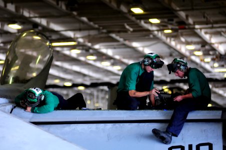 US Navy 100713-N-3659B-170 Aviation Structural Mechanics 3rd Class Mark Alzapiedi, left, from Boston, John Goodwin, from Chesapeake, Va., and John Beard, from Salt Lake City,