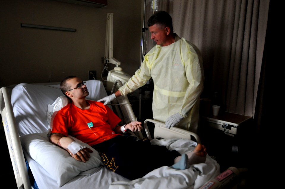US Navy 100714-N-9818V-044 MCPON presents coins at the National Naval Medical Center