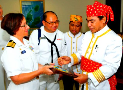 US Navy 100713-N-6410J-121 Capt. Lisa M. Franchetti, commander of Pacific Partnership 2010, presents a plaque to Indonesian official Hein Namotemo