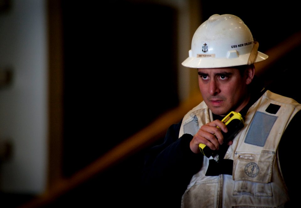 US Navy 100713-N-5319A-056 Chief Boatswain's Mate Roland Tijerina oversees well deck operations aboard the amphibious transport dock ship USS New Orleans (LPD 18)