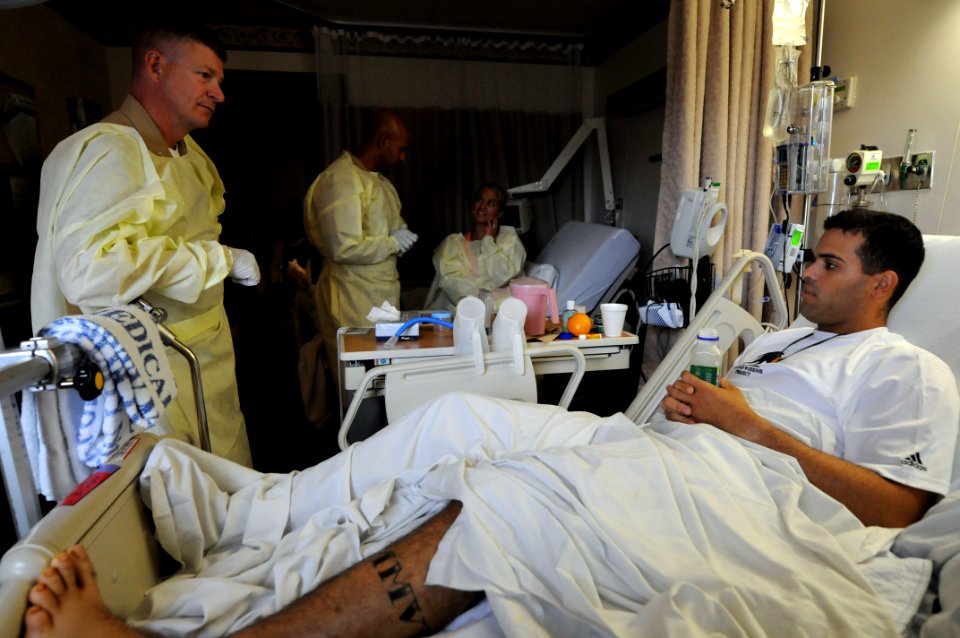 US Navy 100714-N-9818V-053 MCPON presents coins at the National Naval Medical Center