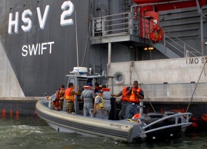 US Navy 100713-N-4971L-078 Sailors assigned to High Speed Vessel Swift (HSV 2) conduct visit, board, search and seizure exercises with Guatemala defense forces during a subject matter expert exchange in Puerto Quetzal, Guatemal photo