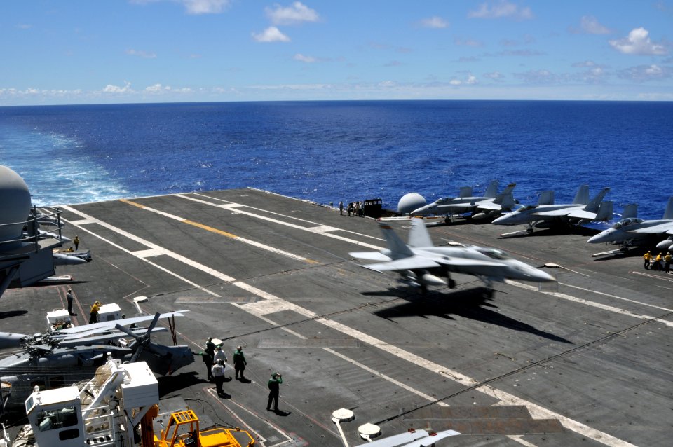 US Navy 100716-N-7042V-098 An F-A-18C Hornet assigned to the Blue Diamonds of Strike Fighter Squadron (VFA) 146 lands on the flight deck of the aircraft carrier USS Ronald Reagan (CVN 76)
