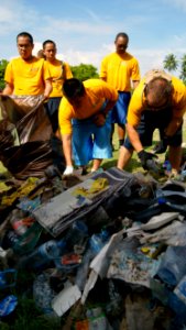 US Navy 100716-N-9706M-082 Sailors and Marines assigned to the amphibious transport dock ship USS Dubuque (LPD 8) clean up a street on Feydhoo Island in the Maldives