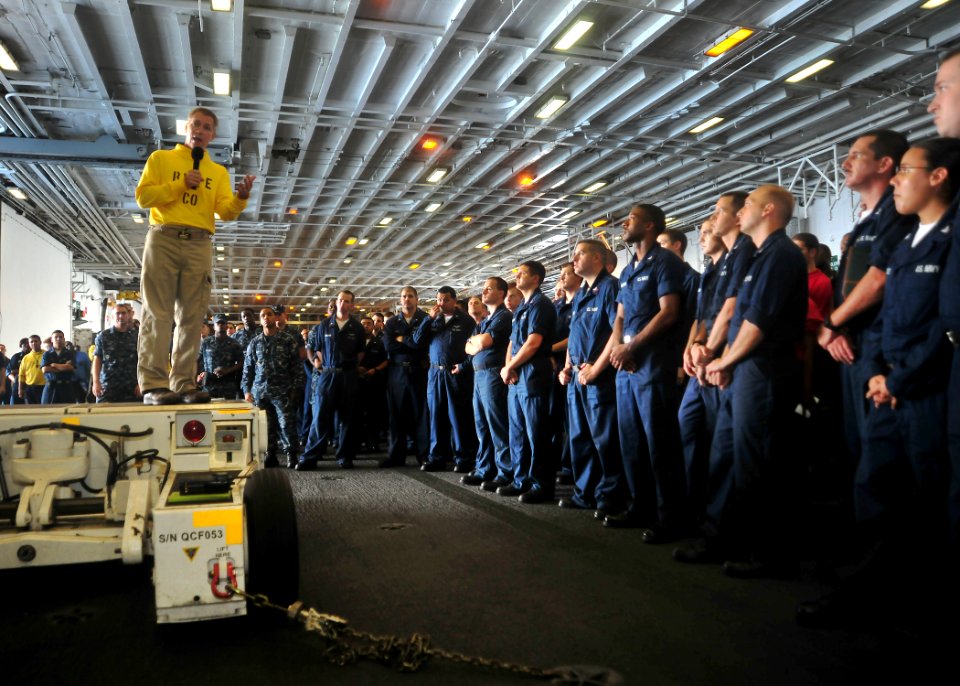 US Navy 100717-N-5082P-005 Capt. O.P. Honors addresses Sailors during a captain's call in the ship's hangar bay aboard USS Enterprise (CVN 65)