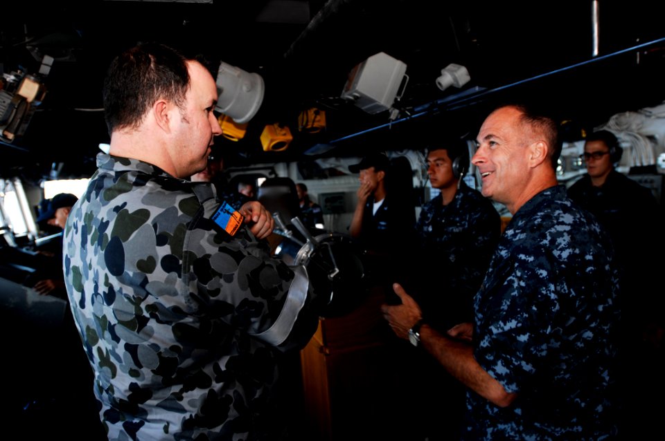 US Navy 100714-N-6477M-051 Capt. S. Robert Roth, right, commanding officer of the amphibious transport dock ship USS Cleveland (LPD 7),