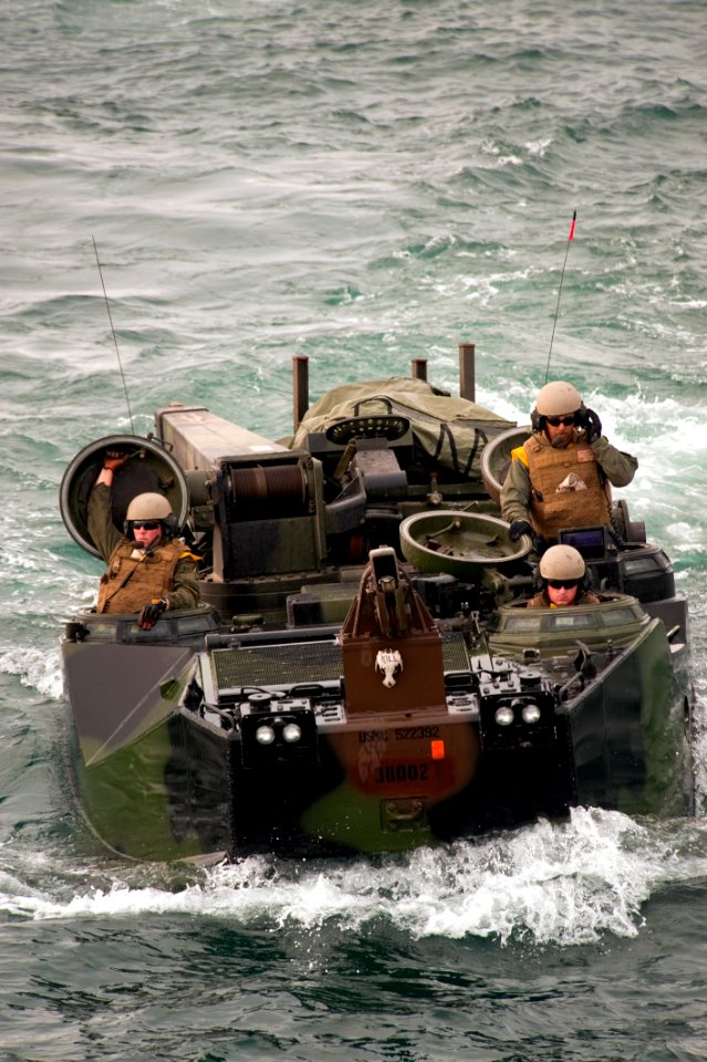 US Navy 100714-N-5319A-104 Marines assigned to Special Purpose Marine Air Ground Task Force 24, return from Salinas Beach, Peru in amphibious assault vehicles to the amphibious transport dock ship USS New Orleans (LPD 18)