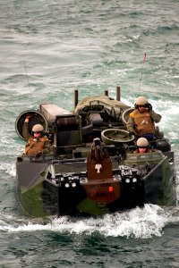 US Navy 100714-N-5319A-104 Marines assigned to Special Purpose Marine Air Ground Task Force 24, return from Salinas Beach, Peru in amphibious assault vehicles to the amphibious transport dock ship USS New Orleans (LPD 18)