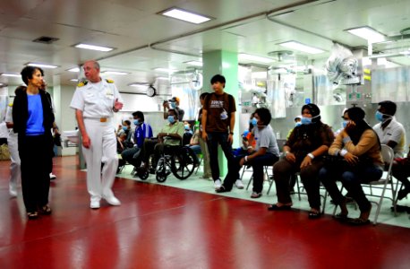 US Navy 100718-N-6410J-085 U.S. Consul General Kristen F. Bauer speaks with Capt. Jeffery Paulson, commanding officer of the Medical Treatment Facility aboard the Military Sealift Command hospital ship USNS Mercy (T-AH 19), photo