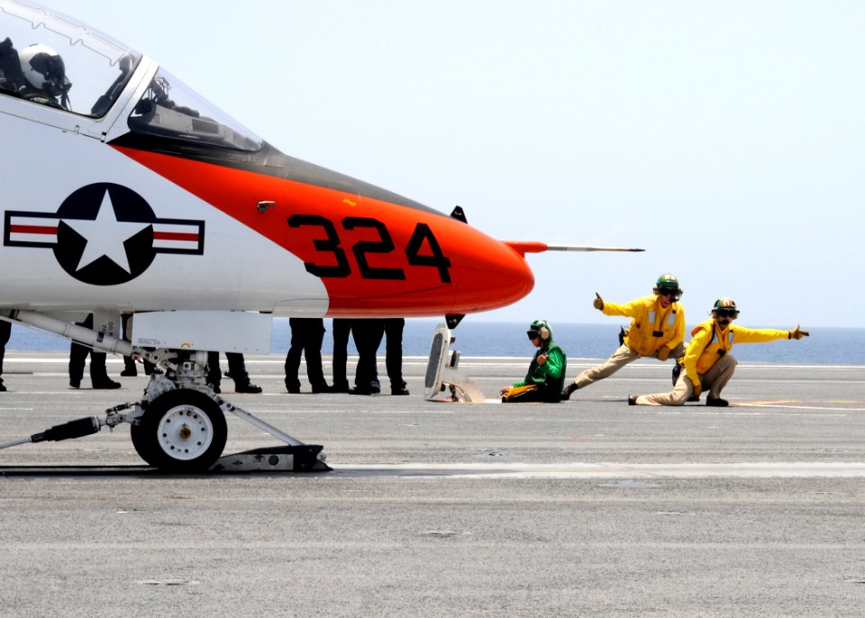 US Navy 100717-N-6632S-582 Shooters prepare to launch a T-45C Goshawk training aircraft assigned to Training Wing (TRAWING) 2 aboard the aircraft carrier USS George H.W. Bush (CVN 77)