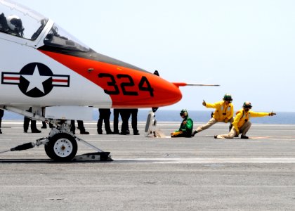 US Navy 100717-N-6632S-582 Shooters prepare to launch a T-45C Goshawk training aircraft assigned to Training Wing (TRAWING) 2 aboard the aircraft carrier USS George H.W. Bush (CVN 77)