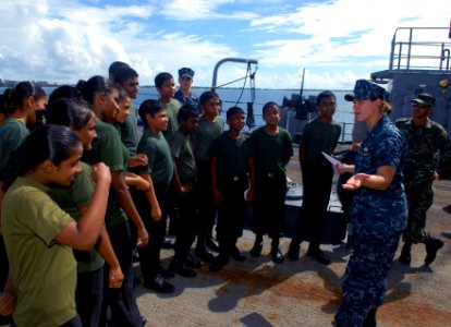 US Navy 100714-N-9706M-214 Lt. j.g. Rebecca Conti-Vock talks to cadets from Feydhoo High School in the Maldives photo