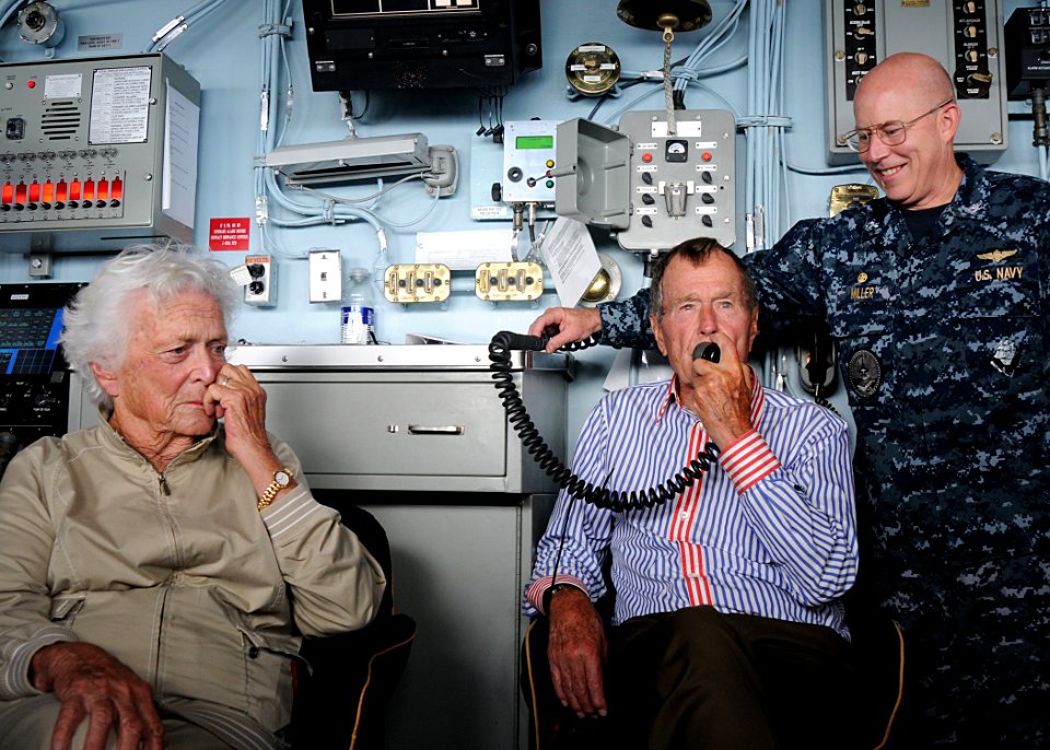 US Navy 100714-N-8689C-455 Former President George H.W. Bush speaks to Sailors via the ship's announcing system aboard the aircraft carrier that bears his name, USS George H.W. Bush (CVN 77)
