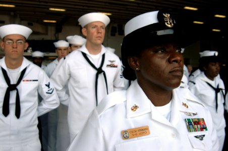 US Navy 100715-N-1281L-133 Master Chief Culinary Specialist Marilyn Kennard leads the honor platoon during a burial at sea aboard the amphibious assault ship USS Makin Island (LHD 8) photo
