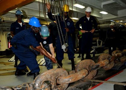 US Navy 100719-N-0569K-087 Sailors work on the anchor chain during a precision anchorage in the foc'sle aboard USS Enterprise (CVN 65)