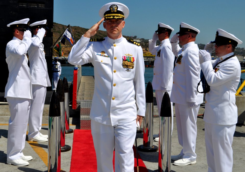 US Navy 100715-N-4047W-004 Cmdr. David Lott salutes the side boys at the conclusion of a change of command ceremony for the Los Angeles-class fast attack submarine