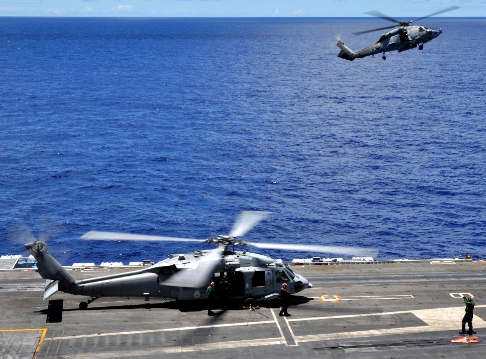 US Navy 100715-N-7042V-080 SH-60 Sea Hawk helicopters assigned to the Black Knights of Helicopter Anti-Submarine Squadren (HS) 4 land aboard the aircraft carrier USS Ronald Reagan (CVN 76)