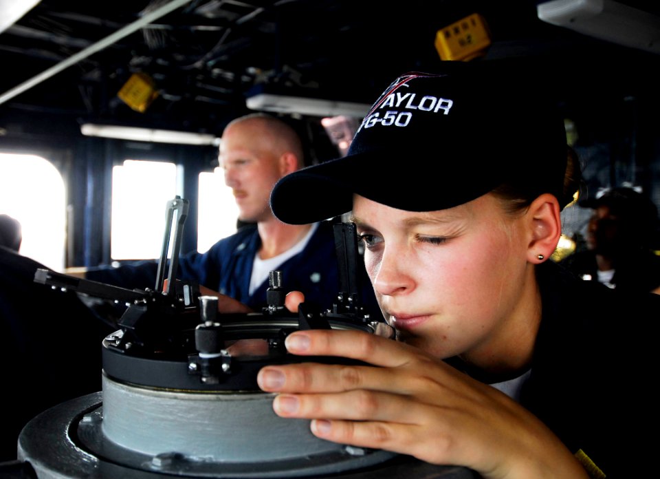 US Navy 100718-N-7638K-143 Ensign Jennifer Gabriel, from Baltimore, Md., verifies the position of the Oliver Hazard Perry-class guided-missile frigate USS Taylor (FFG 50)