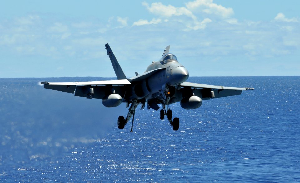 US Navy 100716-N-7042V-115 An F-A-18C Hornet assigned to the Blue Diamonds of Strike Fighter Squadron (VFA) 146 approaches the flight deck of the aircraft carrier USS Ronald Reagan (CVN 76)